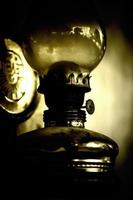 Abstract Vintage Oil Lamp on the Wall photo