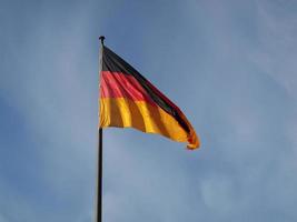 German flag over blue sky photo