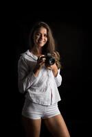 Fashion Portrait of young Woman photographer with camera photo