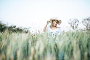 Woman in the hat happiness in the nature photo