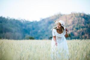 Woman in the hat happiness in the nature photo