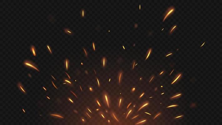 Fire flying sparks on dark background