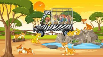 Safari al atardecer con muchos niños viendo un grupo de leopardos.