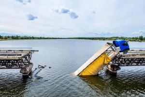 Destruction of bridge structures across the river photo