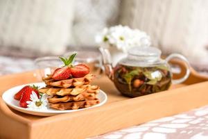 Delicious fresh baked belgian waffles with berries and fruit photo