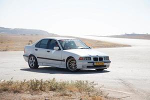 Cars on the race track and on the roads of the desert photo