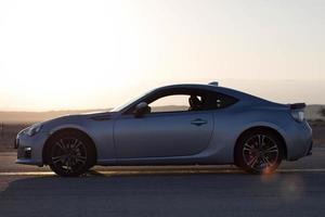 Cars on the race track and on the roads of the desert photo