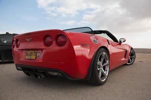 Cars on the race track and on the roads of the desert photo