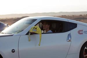 Cars on the race track and on the roads of the desert photo