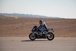 Motorcycle competition at a race track on a training day photo