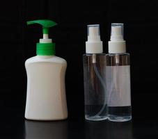 Hand sanitizer isolated on a black background photo