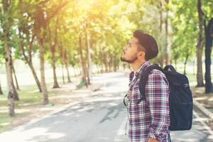 Hipster traveler man looking to nature enjoying fresh weather photo