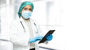 Doctor holding digital tablet to search data