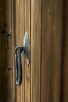 Old metal door handle knocker photo