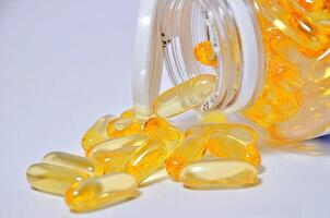 Omega 3 Pill. Yellow pill photo