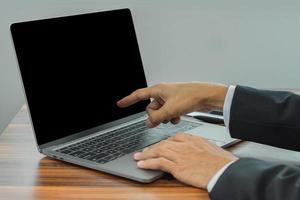 Closeup hand typing keyboard computer working in office photo