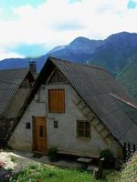 Typical house with its black roof and exaggerated slope photo