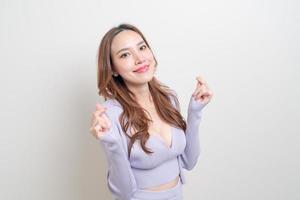 Portrait beautiful Asian woman with mini heart hand sign