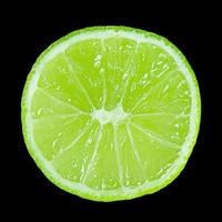 Lime slice isolated on a black background photo