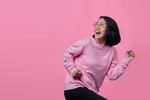 Astonished girl wear pink jumper isolated on pink color background