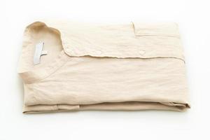 Beige shirt fold isolated on white background photo