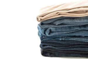 Stacks of clothing on white background photo