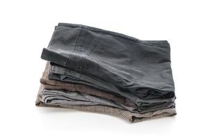 Stacks of clothing on white background photo