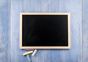 Blackboard background and wooden frame, rubbed out dirty chalkboard photo