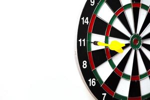 Dartboard with dart arrow hitting the center. Marketing concept. photo