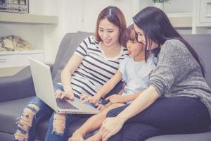 Family and kid learning with using laptop computer. photo