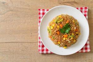 Fried rice with green peas, carrot and corn - vegetarian and healthy food style photo