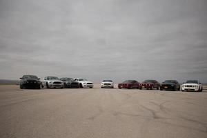 Cars on the race track and on the roads of the desert photo