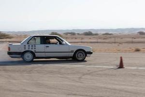 Cars on the race track and on the roads of the desert photo