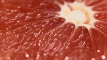 Macro of rotating ripe grapefruit slice video