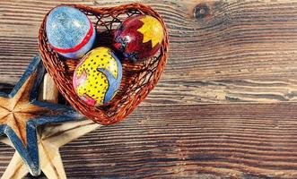 Easter Eggs in a Heart Basket and Sea Stars photo