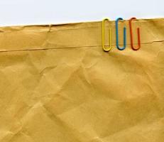 Paperclips on Old Abstract Organic Paper photo