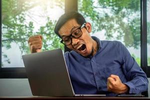 Man happy excited profit trading online, Businessman using computer photo