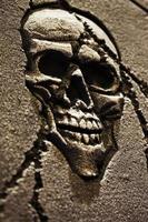 Scary Halloween Symbol Skull on Gravestone photo