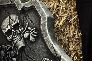 Scary Halloween Symbol Skull on Gravestone photo