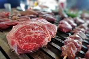 Mixture of Raw Meat on Barbecue photo