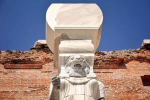 Egyptian Goddess Statue in Red Bazilica of Bergama in Turkey photo