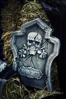 Scary Halloween Symbol Skull on Gravestone photo