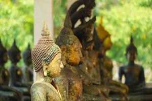 Ancient Buddha, many styles have rust and erosion on skin texture photo