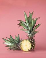 Pineapple fruit isolated on pink background. photo
