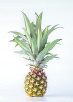 Pineapple fruit isolated on white background with clipping path. photo