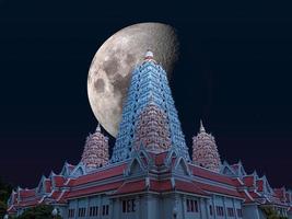 Half moon over Buddhagaya pagoda and heap white cloud on sky photo