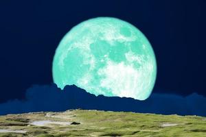 Super harvest moon background on mountain night sky photo