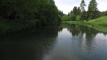 Aerial view of fly fishermen on lake video