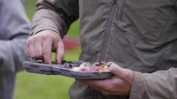 Fly fishermen prepare for fishing video