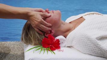 Woman at spa gets head massage. video